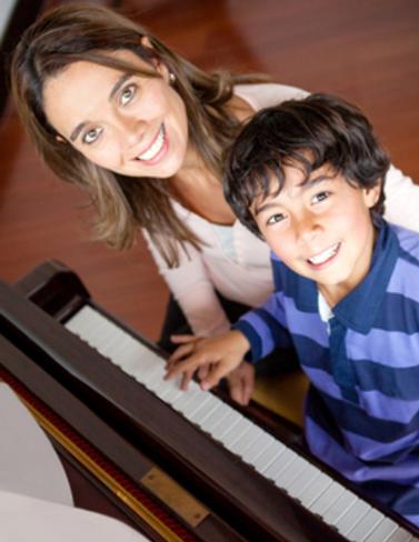 Boy learning how to the play piano