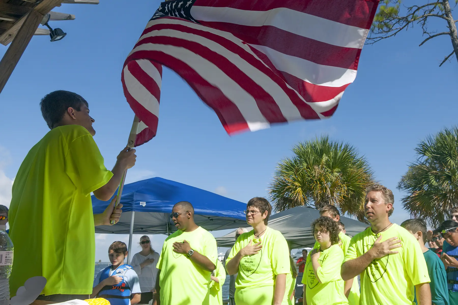 SUP Coach, Dana Ackeridge, with 3 athletes at Area Games Competition held at Baytown Marina
