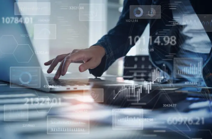 Businesswoman working on laptop computer analyzing sales data and economic growth graph chart. Business strategy, digital market report analysis, data scientist