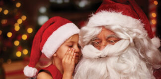 Santa with child whispering