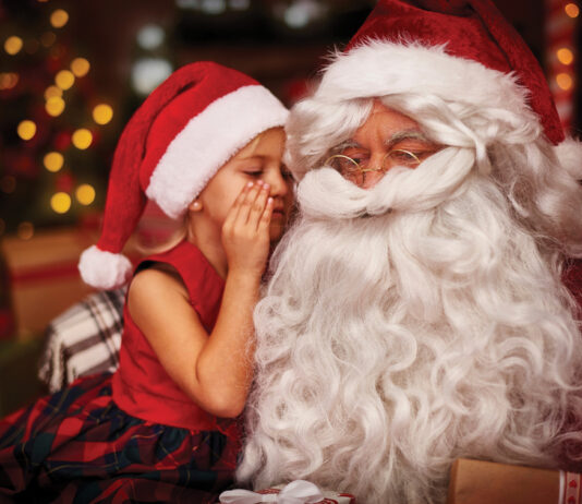 Santa with child whispering