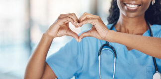 Nurse making heart