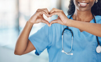 Nurse making heart