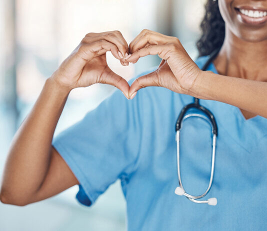 Nurse making heart