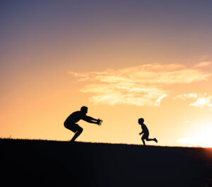 Father and son having fun in the park.