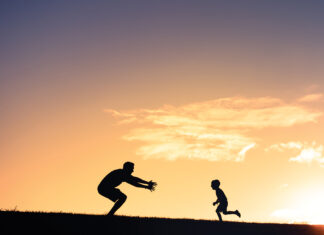 Father and son having fun in the park.