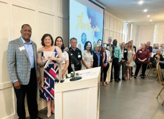 United Way Emerald Coast Board of DIrectors celebrate a contribution from FPL