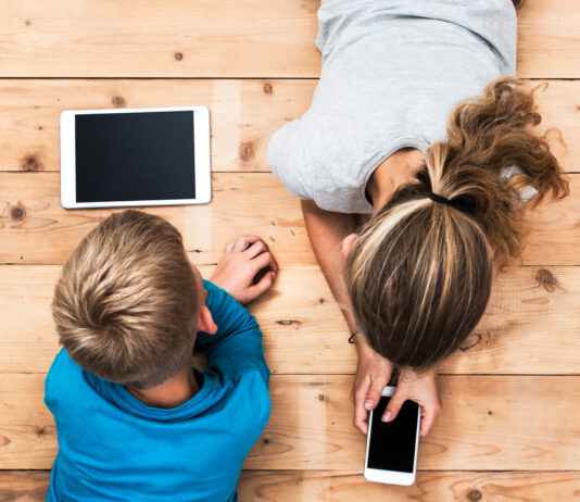 Kids playing with mobile devices