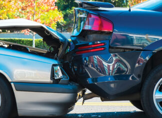 Auto accident involving two cars on a city street