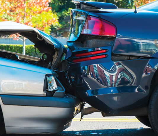 Auto accident involving two cars on a city street