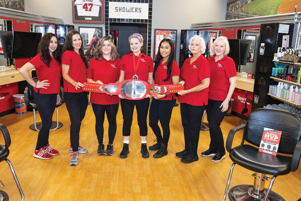 Sports Clips team members (left to right) Katrina, Lauren, Sami, Jessica, Kiana, Sherry and Team Leader Mitzi Henley