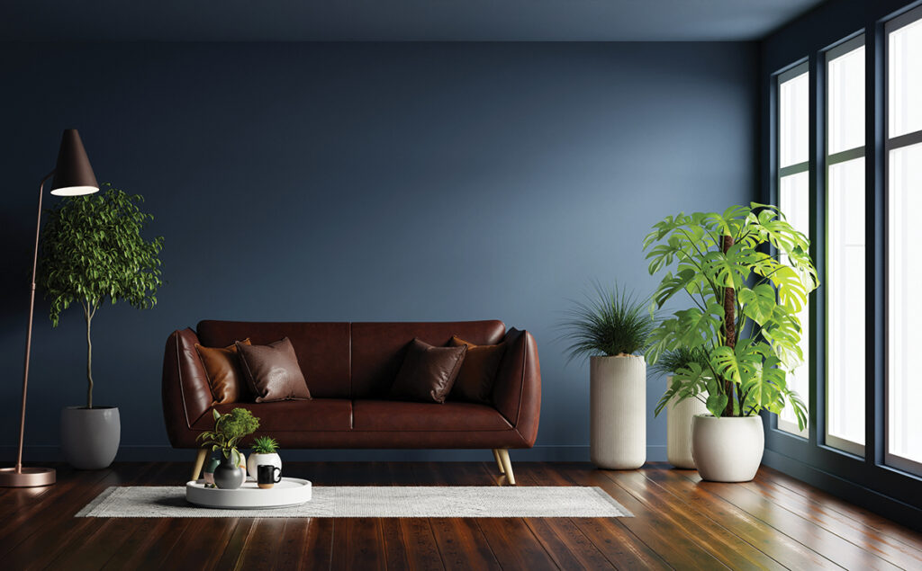 Modern interior of living room with leather sofa on wood flooring and dark blue wall- 3D rendering