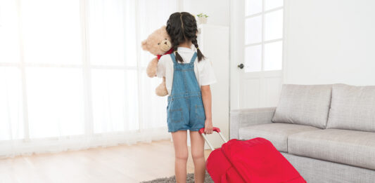 Child with suitcase